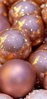 A mesmerizing live phone wallpaper featuring a pile of Christmas ornaments