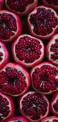 Get a glimpse of the bountiful nature with this stunning phone live wallpaper featuring symmetrical pomegranates