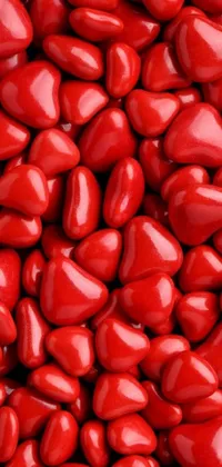 Enhance your phone's aesthetics with this vibrant, romantic close-up live wallpaper featuring glazed, high-detail antipodean red hearts