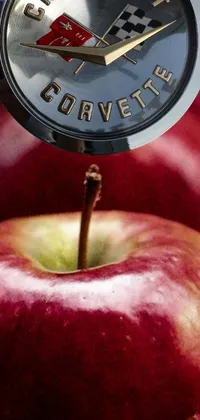 Looking for an intricately designed phone live wallpaper? This one is for you! Featuring a photorealistic still life of a clock resting on an apple, this wallpaper is both classic and modern