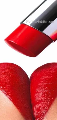 This stunning phone live wallpaper presents a photorealistic image of a person's hand holding a vibrant, red lipstick tube