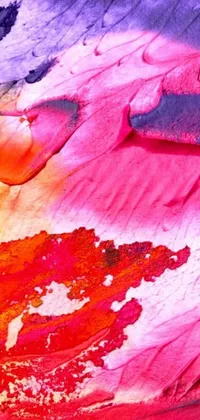 This lively iPhone live wallpaper showcases a vibrant abstract painting composed of pink and orange powder paints