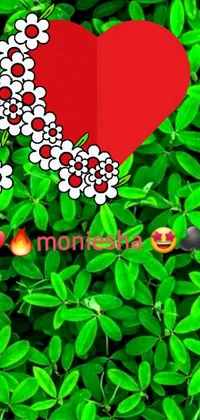 This captivating live wallpaper features a vibrant red heart exquisitely adorned with lush green leaves, surrounded by a stunning bouquet of blooming flowers