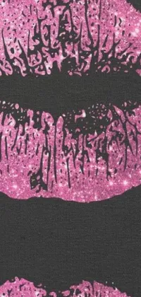 This phone live wallpaper features a stunning pair of pink glitter lips on a black background that will add a touch of sophistication and glamour to your phone