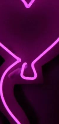 This live phone wallpaper features a neon heart-shaped sign made of liquid purple metal