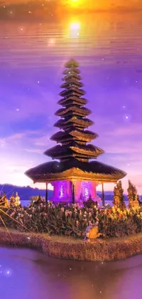This stunning live wallpaper depicts a magnificent pagoda sitting atop calm Bali waters