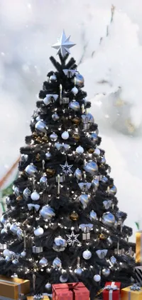 Get in the festive spirit with this stunning Christmas phone live wallpaper featuring a digital rendering of a beautiful Christmas tree with twinkling lights, baubles, and snowflakes