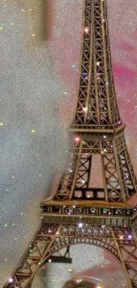 This stunning phone live wallpaper features a close-up of a pointillism painting of the iconic Eiffel Tower