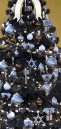 This Christmas-themed live wallpaper for phones showcases a stunning close-up of a beautiful tree adorned with sparkly ornaments in silver and black with gold accents