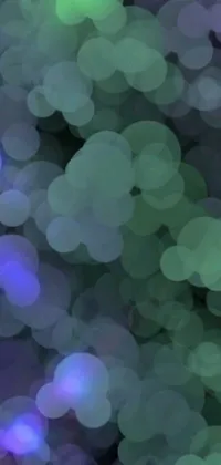 This phone live wallpaper features a mesmerizing display of blurry lights in blue, purple and green hues