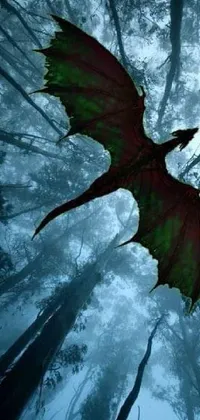 Bring your phone to life with this stunning live wallpaper featuring a green and red dragon soaring through a mystical forest