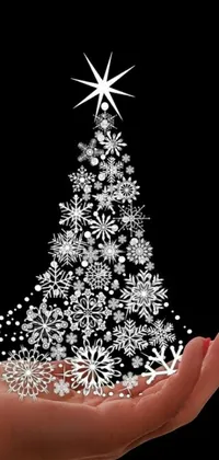 Looking for a stunning Christmas live wallpaper for your phone? Check out this elegant design featuring a beautiful hand-crafted Christmas tree made purely of snowflakes and set against a sleek black background