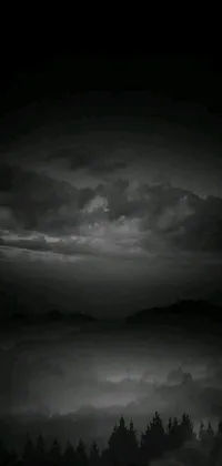 Enjoy the haunting vibe of the night sky on your phone with this black and white live wallpaper