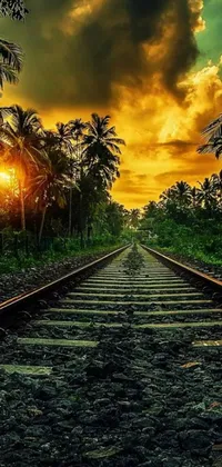 This mobile wallpaper depicts a train track set against a beautiful sunset background