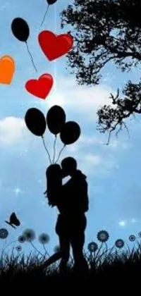 This phone live wallpaper depicts a romantic scene with a couple kissing under a tree