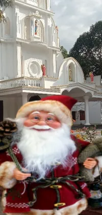 This festive live wallpaper features a beautiful church with a statue of Santa Claus in front