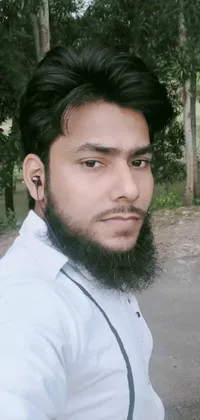 This live phone wallpaper showcases a bearded man wearing a white shirt from Bangladesh, gazing with a blank expression