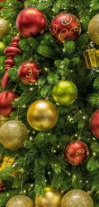 Decorate your phone with this stunning Christmas tree live wallpaper featuring close-up shots of red, green, and yellow ornaments