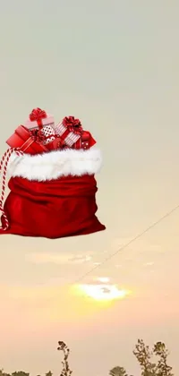 Add a festive touch to your mobile screen with this Santa Claus bag live wallpaper