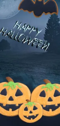 This live wallpaper showcases three pumpkins in front of a full moon