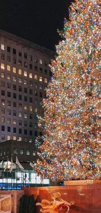 This stunning live wallpaper features a dazzling Christmas tree in New York City, surrounded by glowing lights