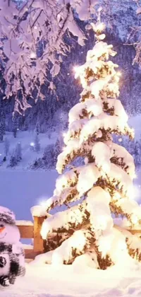 This live phone wallpaper depicts a beautiful festive scene of two snowmen standing beside a decorated Christmas tree