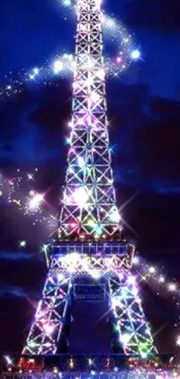 Experience the captivating beauty of Paris at night with this enchanting Eiffel Tower live wallpaper