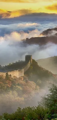 This phone live wallpaper features a stunning scenic view with the sun shining through the clouds over the mountains, the Great Wall and a misty castle in the distance, and colorful autumn leaves falling gently in the background