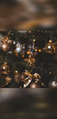 This baroque-inspired phone live wallpaper showcases a beautiful close-up of a Christmas tree adorned with shiny ornaments against a brown and gold color scheme