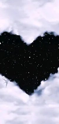 Introducing a beautiful live wallpaper for your phone showcasing a heart-shaped cloud in the center with a black night sky in the background