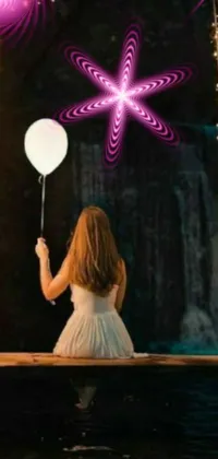 This mobile live wallpaper showcases a beautifully designed artwork of an elegant girl dressed in white holding a white balloon