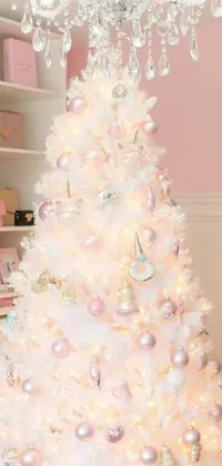 Get into the holiday spirit with this stunning live wallpaper! Featuring a beautiful white Christmas tree adorned with pink ornaments that perfectly complements the pastel color scheme