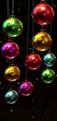 This Christmas-themed live wallpaper features colorful balls hanging from strings and swaying gently in the breeze