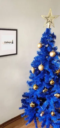 Add a touch of festivity and elegance to your phone screen with this stunning blue Christmas tree live wallpaper
