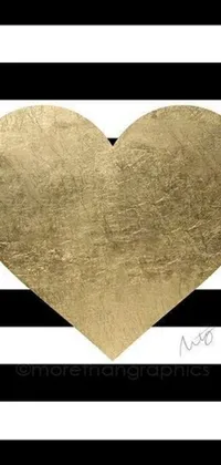 Get mesmerized by this stunning mobile wallpaper featuring a shining gold heart placed on a contrasting black and white striped background