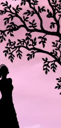 This stunning phone live wallpaper features a graceful silhouette of a woman standing under a tree