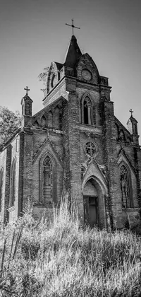 Looking for a captivating live wallpaper for your phone? Check out this stunning black and white photo of an old, abandoned gothic revival church from Minnesota