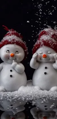 This live wallpaper showcases a delightful winter wonderland scene featuring a group of snowmen hanging out together