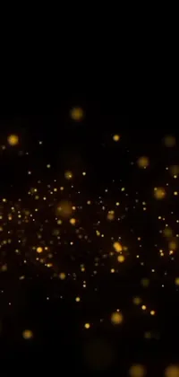 This stunning live wallpaper features a black background adorned with golden sparkles that twinkle and dance as you move your phone