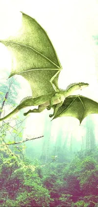 This live phone wallpaper showcases a beautiful, digitally crafted image of a green dragon flying over a lush, vibrant forest