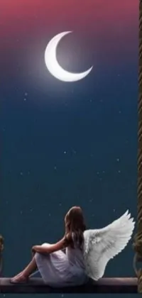 This phone live wallpaper depicts a serene setting with a girl sitting on a swing, gazing at the moon, surrounded by epic angel wings