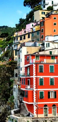 Transform the home screen of your phone with this lively wallpaper featuring Italian-style buildings that gracefully adorn the hillside