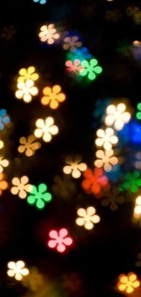 This phone live wallpaper offers a stunning composition of blurry lights, macro photography, flickr-inspired elements, hurufiyya motifs, flower power designs, colorful dots, flowery wallpaper, holiday season motifs, and glittery shimmer effects