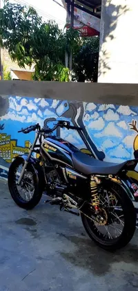 This phone live wallpaper showcases a visually striking mural in the background, with a stunning motorcycle parked in the foreground