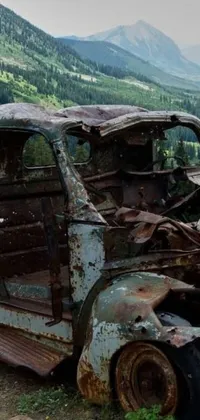 Make your phone come alive with the charm of the mountains! This live wallpaper features an old, rusted truck abandoned on a serene mountain road in Colorado