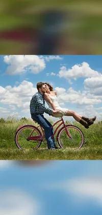 This phone live wallpaper portrays a romantic scene of a couple riding a bike together towards the unknown, surrounded by sunflowers under a bright blue sky