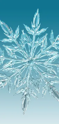 The phone live wallpaper features a digital rendering of a snowflake, creating a realistic and mesmerizing scene on a blue background