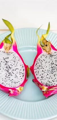 This phone live wallpaper showcases a striking imagery of a halved dragon fruit on a plate with a tropical vibe