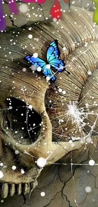 This phone live wallpaper boasts a stunning digital art depiction of a skull adorned with a blue butterfly