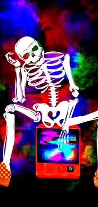 Make a statement on your phone with this vibrant live wallpaper featuring a skeleton sitting on top of a retro cell phone